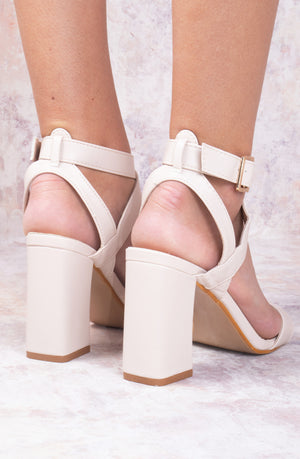 
            
                Load image into Gallery viewer, Beige Faux Leather Heeled Sandal With Cross Over Front Strap
            
        